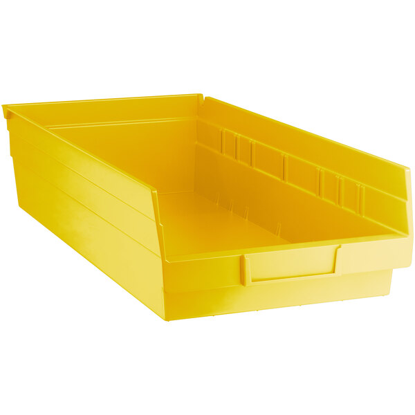 a yellow plastic bin with a drawer