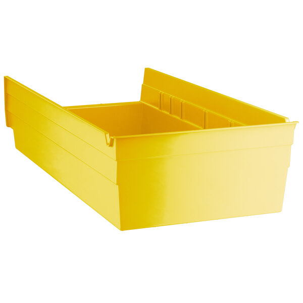 A yellow Regency plastic shelf bin with two compartments.