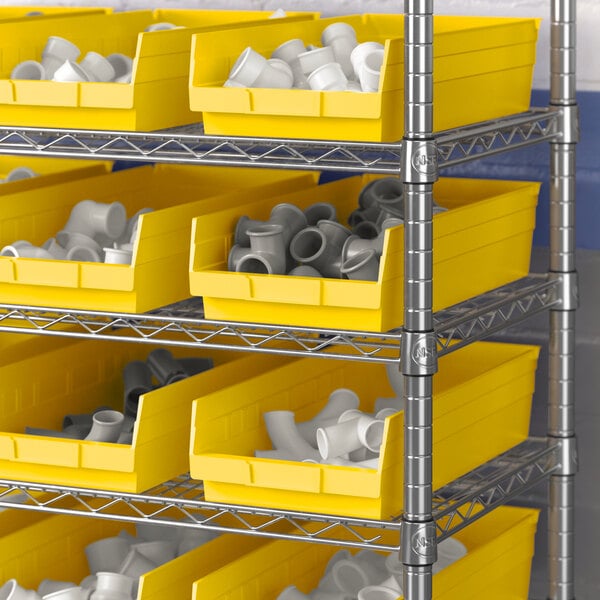 A metal shelving unit with yellow Regency shelf bins.