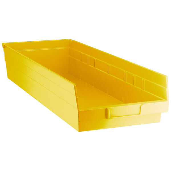 A yellow Regency plastic shelf bin.
