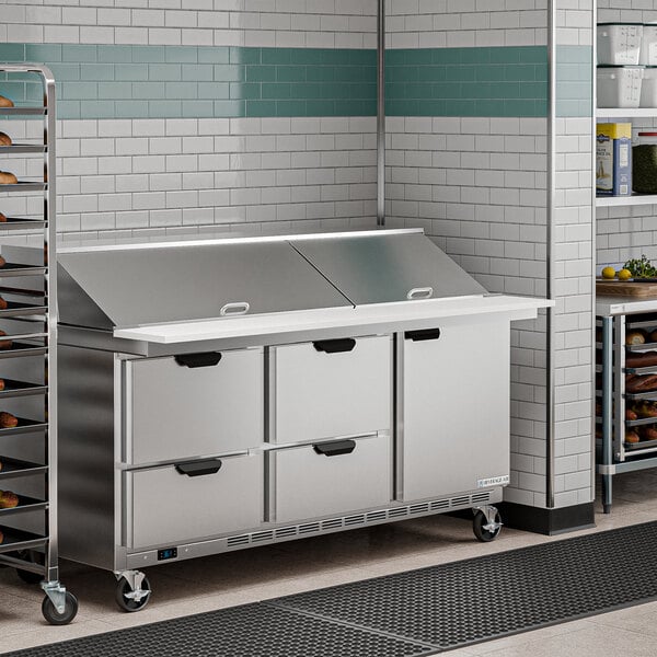 A Beverage-Air refrigerated sandwich prep table on a large counter in a commercial kitchen.