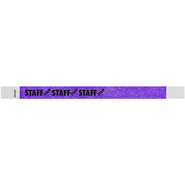 A purple Carnival King Tyvek wristband with black text reading "STAFF"