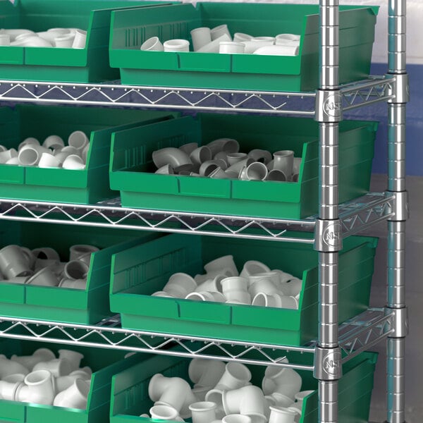 a shelf with green bins