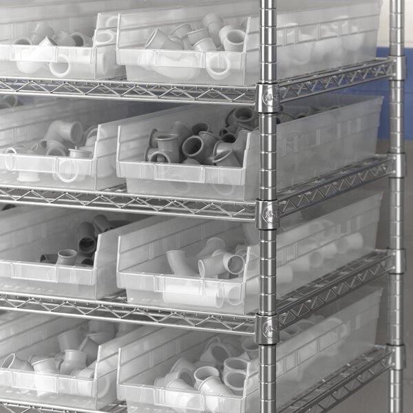 Regency clear plastic shelf bins on a metal shelf.