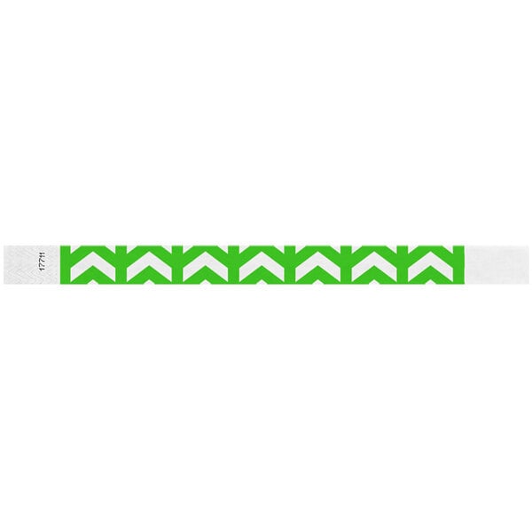A neon green wristband with white arrows pointing up.