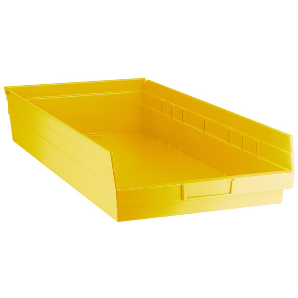 A yellow plastic shelf bin.