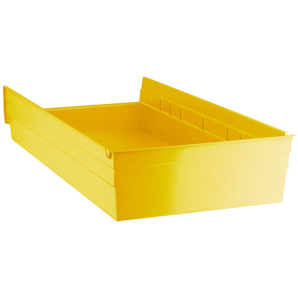 A yellow plastic Regency shelf bin.