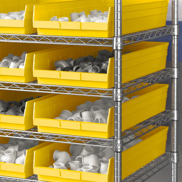 A metal shelving unit with yellow Regency shelf bins.