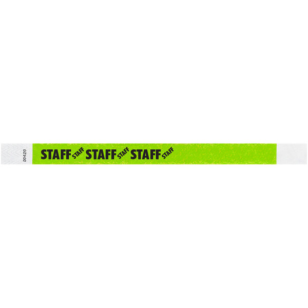 A green and white Tyvek wristband with black text reading "STAFF" and a star.