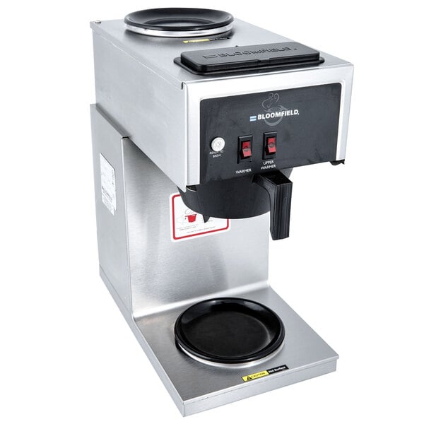 A silver and black Bloomfield Koffee King coffee maker on a stainless steel base.