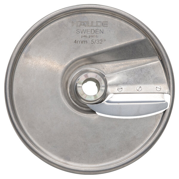 A stainless steel Hobart food slicing plate with a blade and a hole in the center.