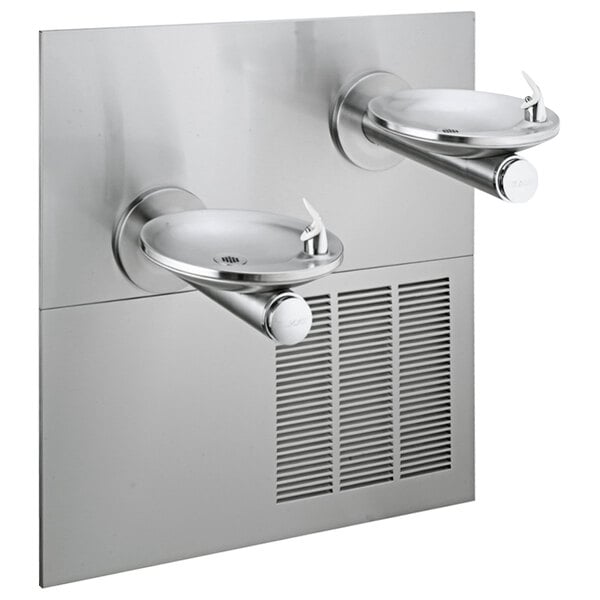 An Elkay stainless steel wall mount drinking fountain with two faucets over a white splash-resistant basin.