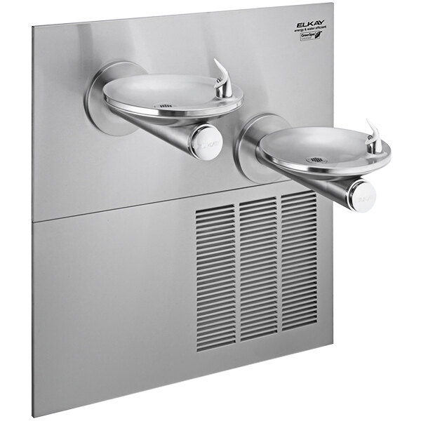 An Elkay stainless steel wall mount drinking fountain with two faucets over an oval sink.