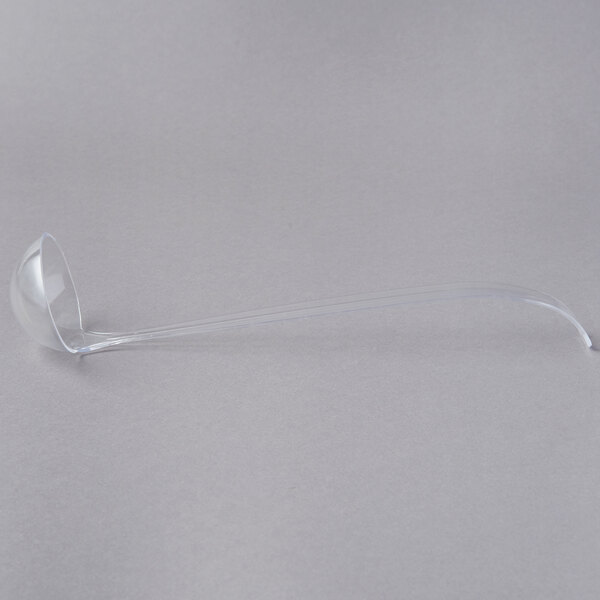 A clear plastic ladle.