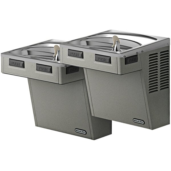 An Elkay light gray granite wall mount reverse bi-level mechanical water fountain with a tap.