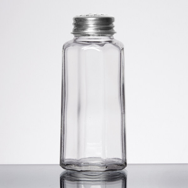 A Tablecraft clear glass salt shaker with a metal top.