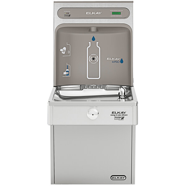 A stainless steel Elkay water fountain with a bottle filling station and faucet.