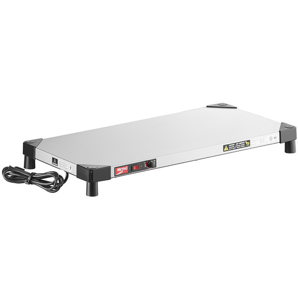 A stainless steel rectangular Metro countertop warmer with a black cord.