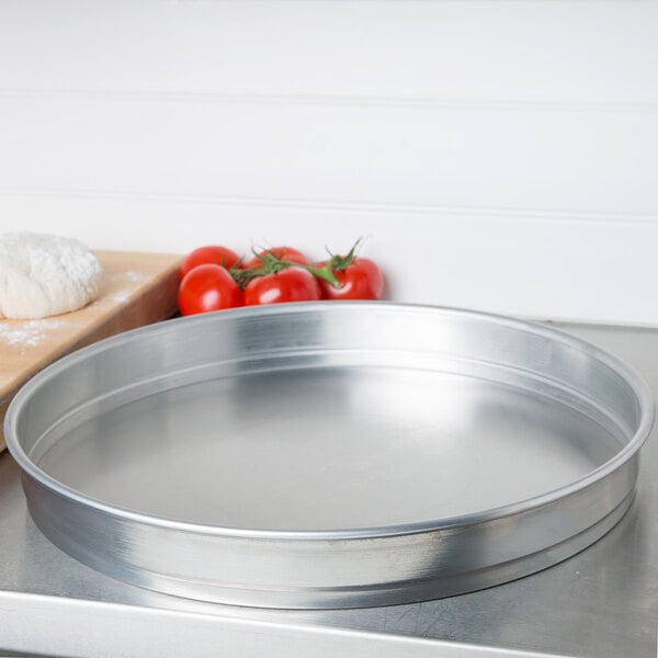 An American Metalcraft aluminum cake pan on a counter.