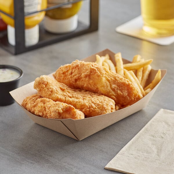 A Bagcraft Packaging EcoCraft paper food tray filled with fried chicken, french fries, and a drink.