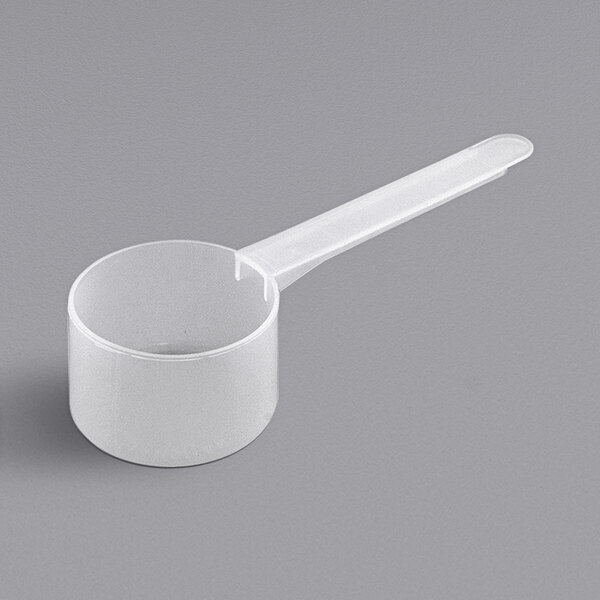 A white plastic measuring scoop with a long handle.