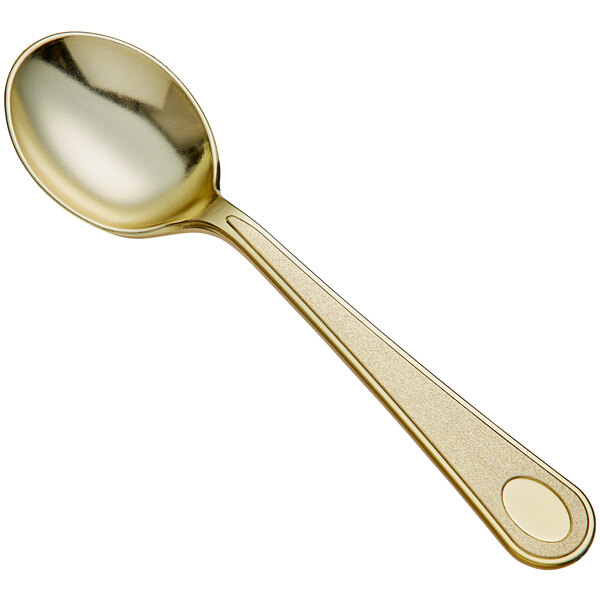 A Visions heavy weight gold plastic soup spoon with a handle.