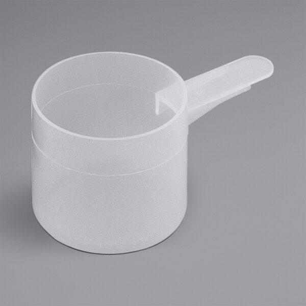 A white plastic measuring scoop with a short handle.