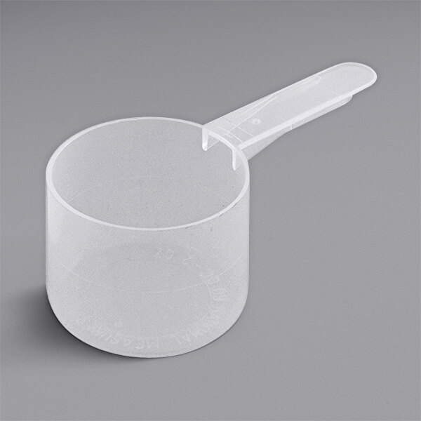 A white plastic measuring scoop with a medium handle.