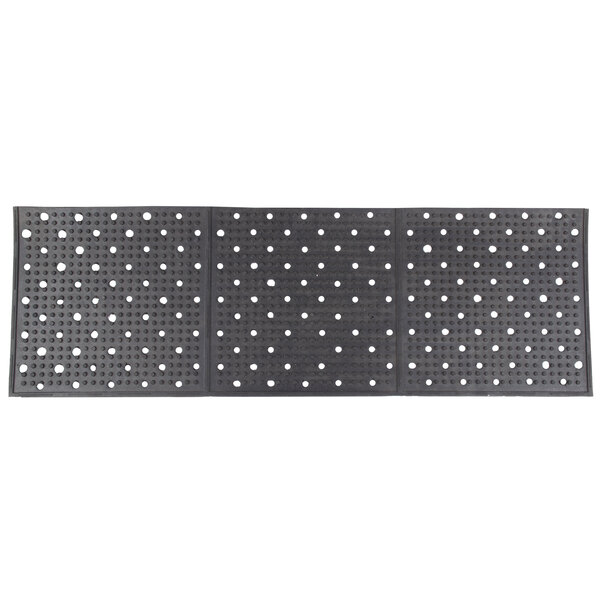 A close-up of a black Cactus Mat with white dots on it.