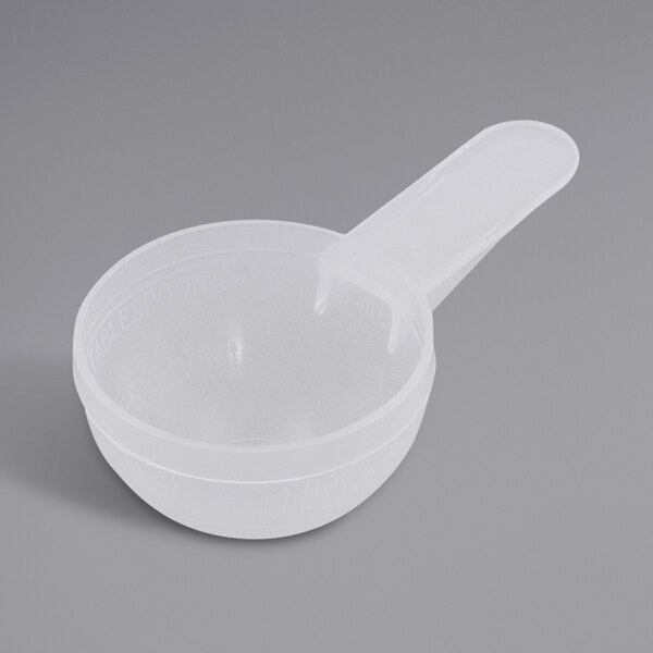 a plastic measuring cup with a handle