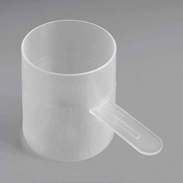 A clear plastic container with a short-handled scoop on top.