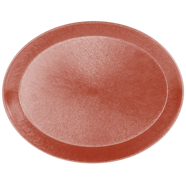 An oval paprika polypropylene deli server on a table in a deli.