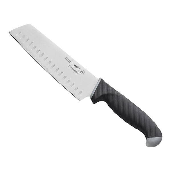 a large knife with a black handle