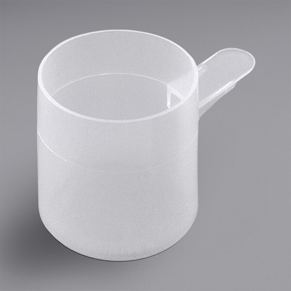 A close-up of a white cylinder with a scoop on top.
