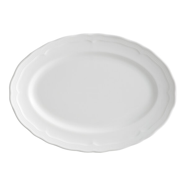 An oval-shaped, pearl white porcelain platter with a scalloped wide rim.