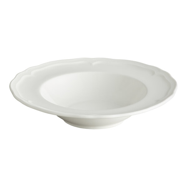 A white porcelain bowl with a scalloped wide rim and a shallow, rounded center.