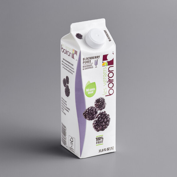A carton of Les Vergers Boiron Blackberry 100% Fruit Puree with berries on it.