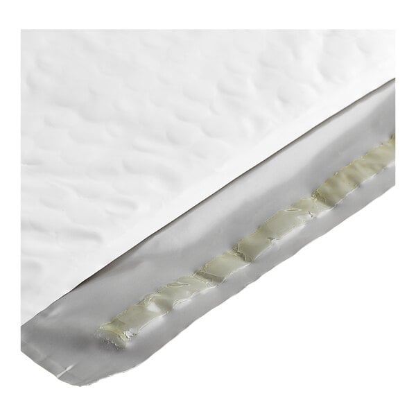 A white polyethylene bubble mailer with a self-sealing adhesive strip.