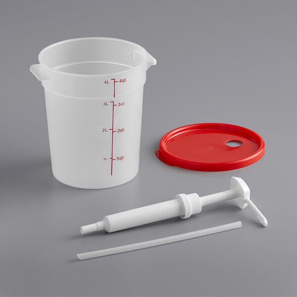 A white plastic container with a red lid and a syringe pump.