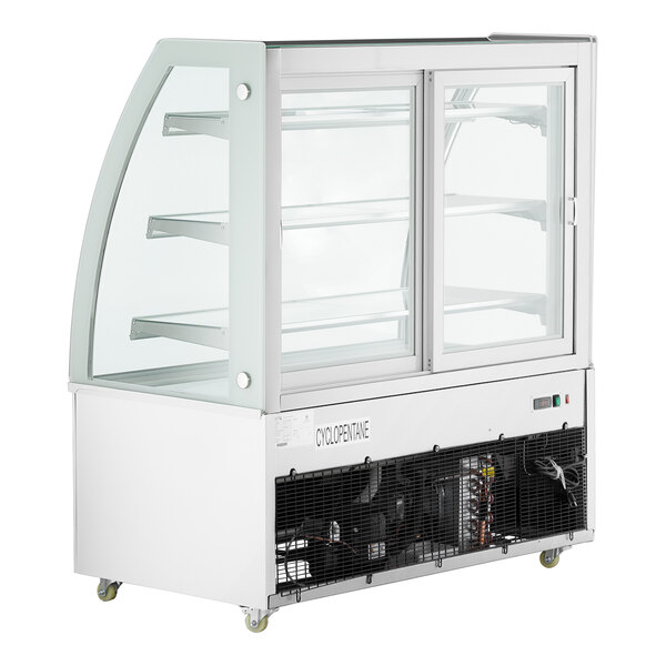 A white 3-shelf curved glass refrigerated bakery display case with LED lighting.