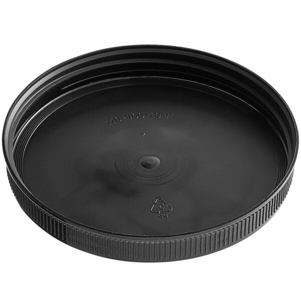 A 110/400 black plastic ribbed cap with a circular lid.