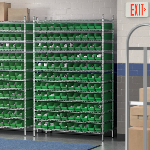A Regency wire shelving unit with green bins on each shelf.