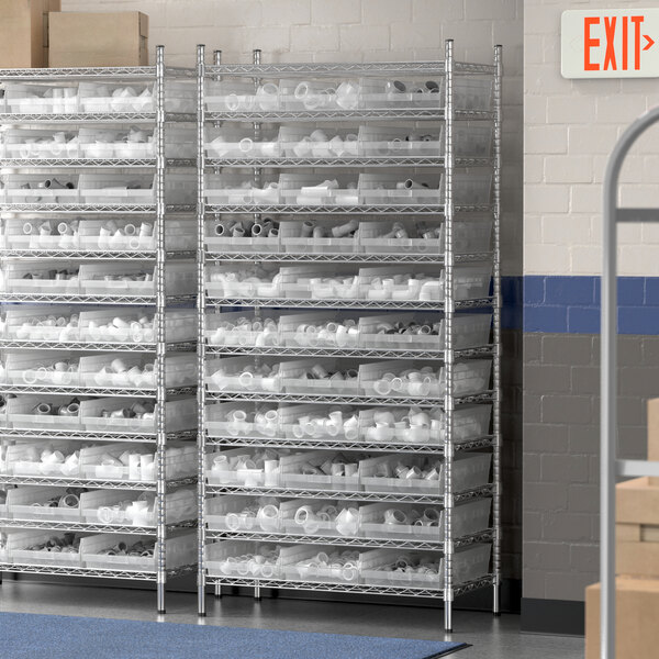 A Regency metal wire shelving unit with clear plastic bins on shelves.