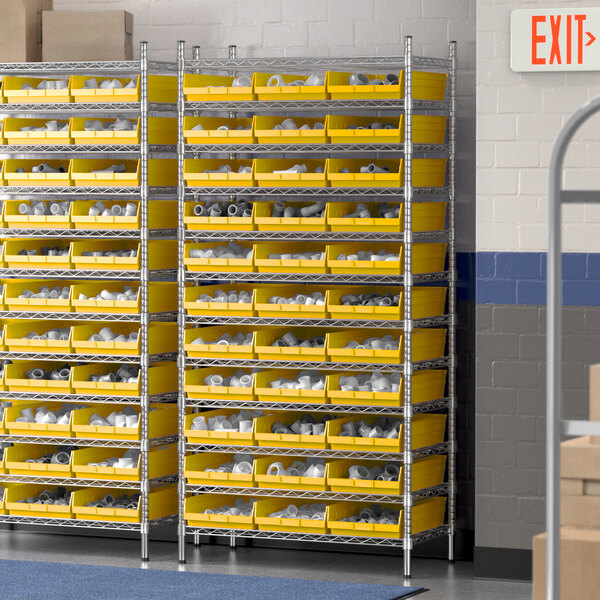 A Regency wire shelving unit with yellow bins on yellow metal shelves.