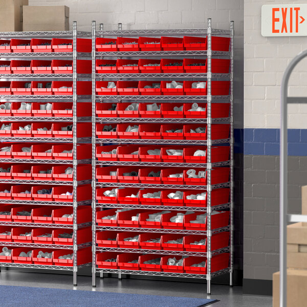 A Regency wire shelving unit with red bins on metal shelves.