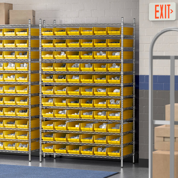 A Regency wire shelving unit with yellow storage bins on each shelf.