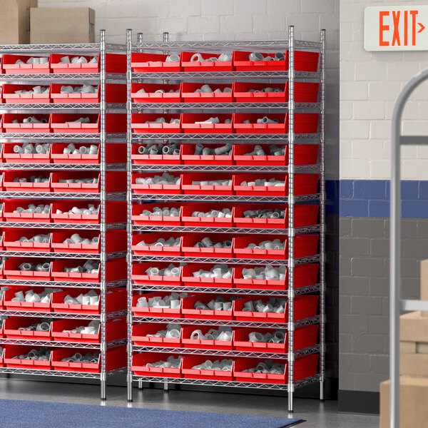 A Regency wire shelving unit with red bins on each shelf.