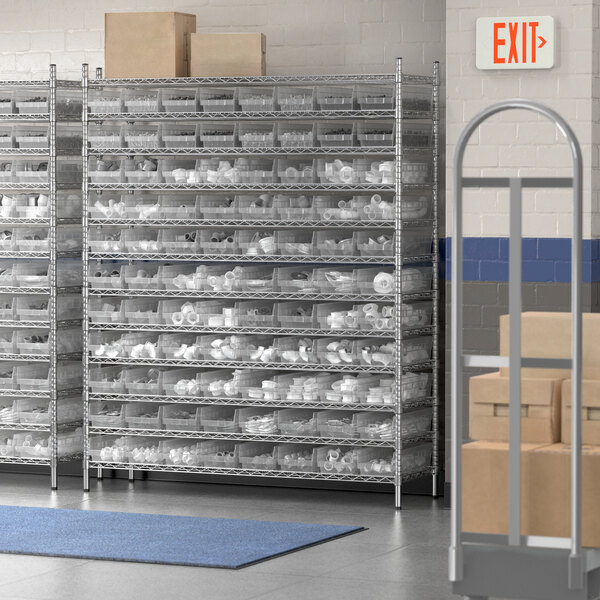 A Regency metal wire shelving unit with clear plastic bins on the shelves.