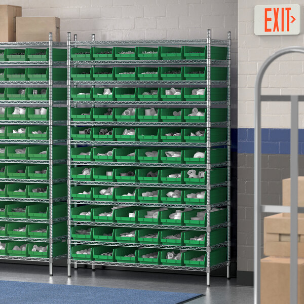 A Regency wire shelving unit with green bins on shelves.