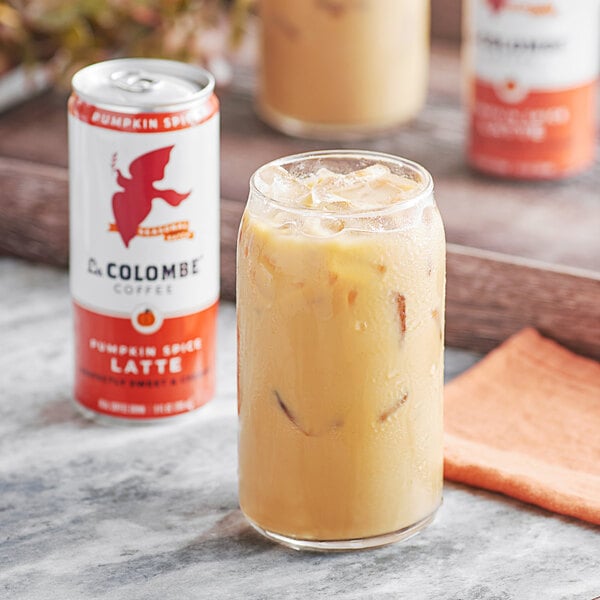 A La Colombe Pumpkin Spice Latte in a glass on a table.